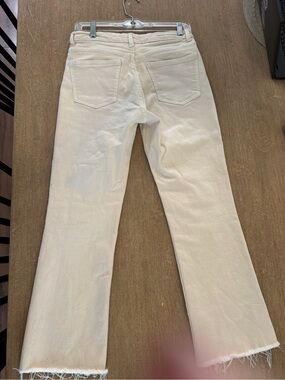 Zara ecru cream cropped straight-leg jeans with a raw hem.